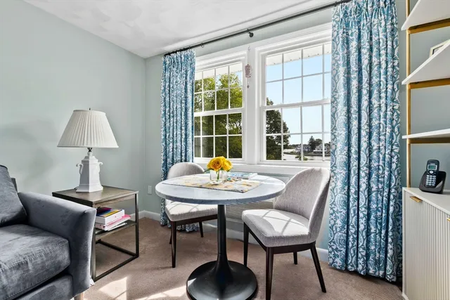 a outdoor living room with furniture and a window