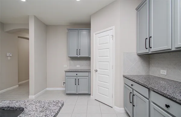 a kitchen with stainless steel appliances granite countertop a stove and a sink