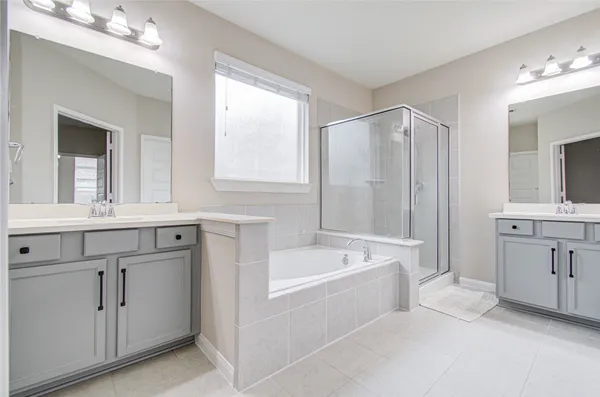 a bathroom with a bathtub and a sink