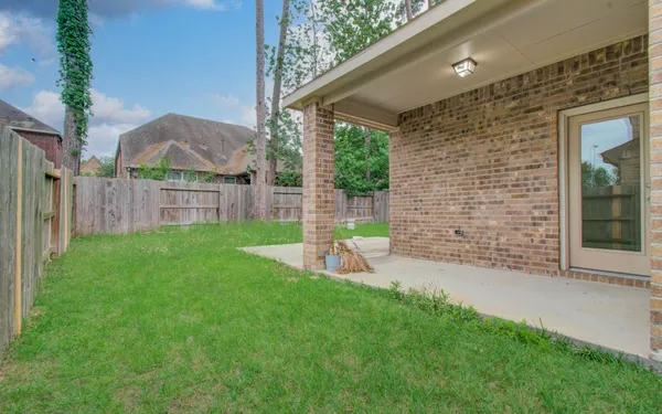 a view of a house with a yard and a garden