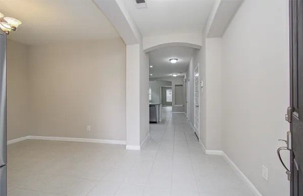 a view of a hallway with a room