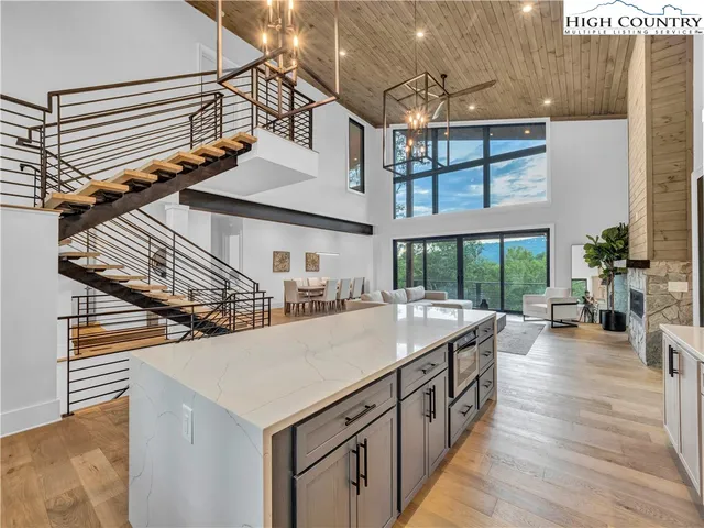 a kitchen view with table and chairs