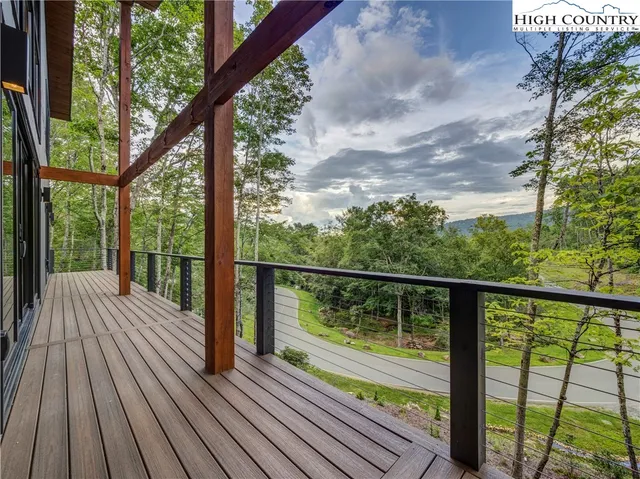 a view of balcony with wooden floor