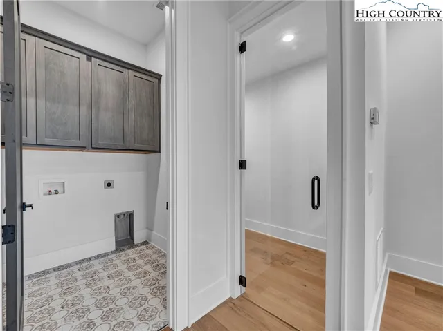 a bathroom with a shower and a sink