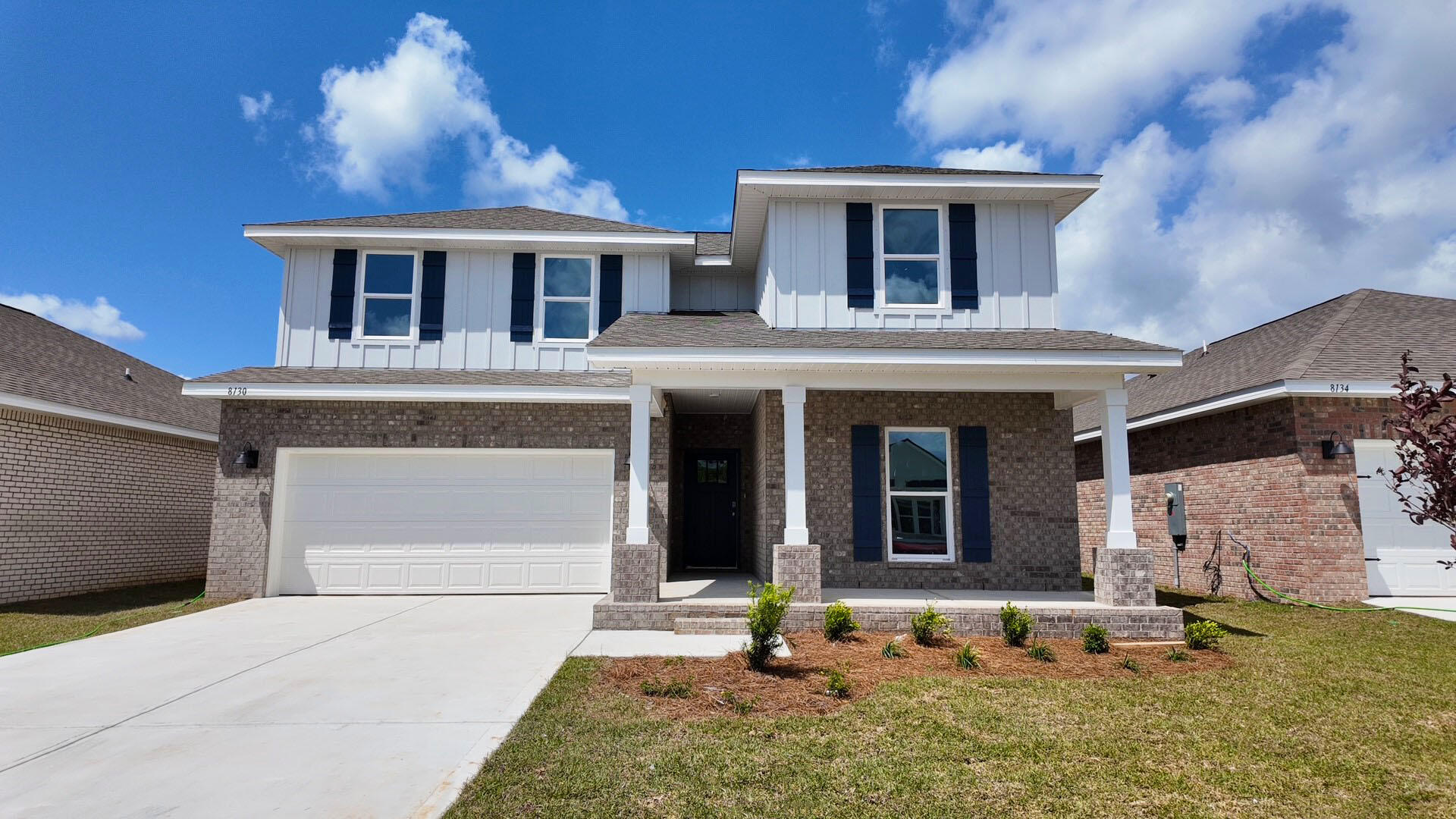8130 Fir Tree Drive Milton, FL 32583 - Photo 1 of 37 a front view of a house with garden