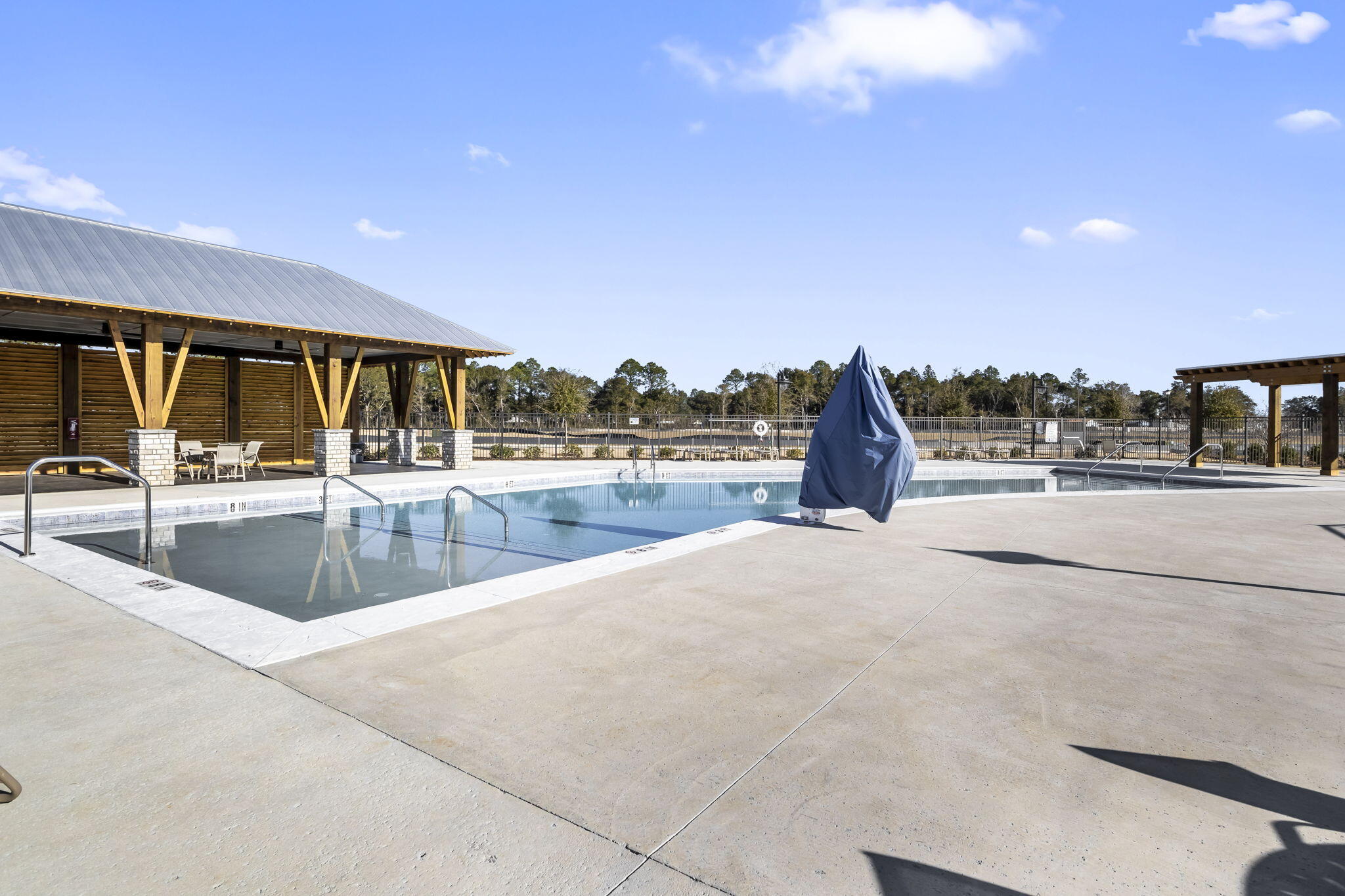 8130 Fir Tree Drive Milton, FL 32583 - Photo 12 of 37 a view of a swimming pool and outdoor kitchen