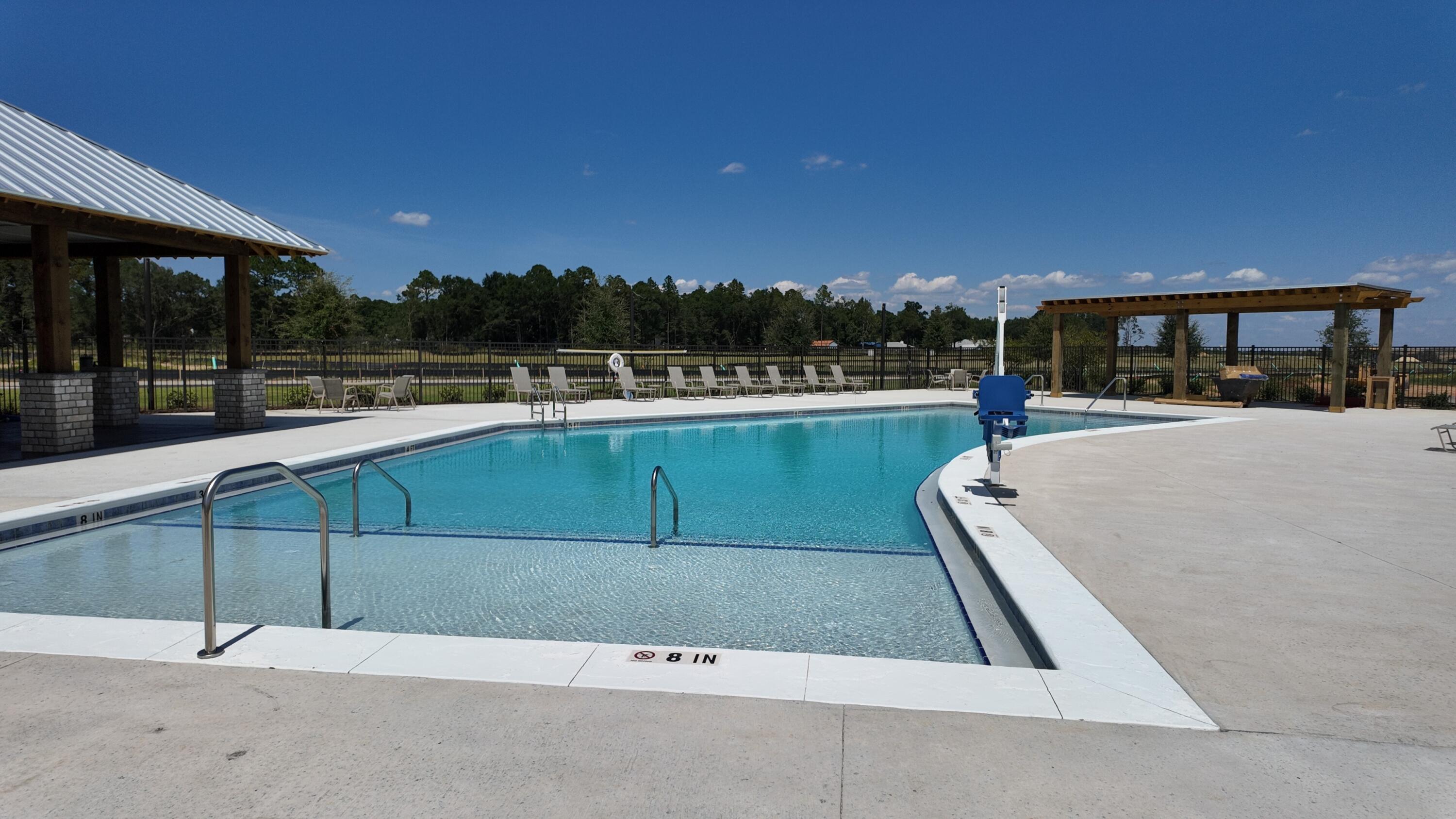 8130 Fir Tree Drive Milton, FL 32583 - Photo 15 of 37 a view of a swimming pool with a patio