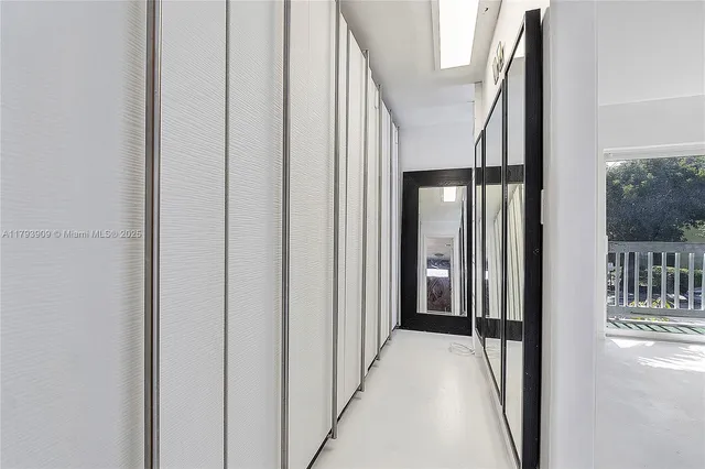 a view of a hallway with a dining room