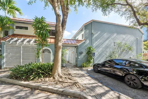 a car parked in front of a house