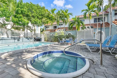 a backyard of a house with outdoor seating