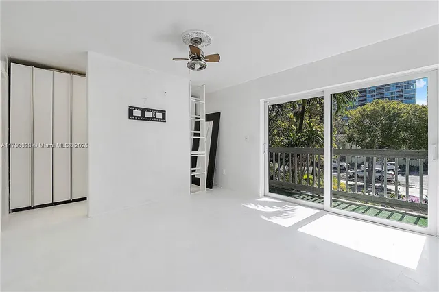 a view of empty room with windows