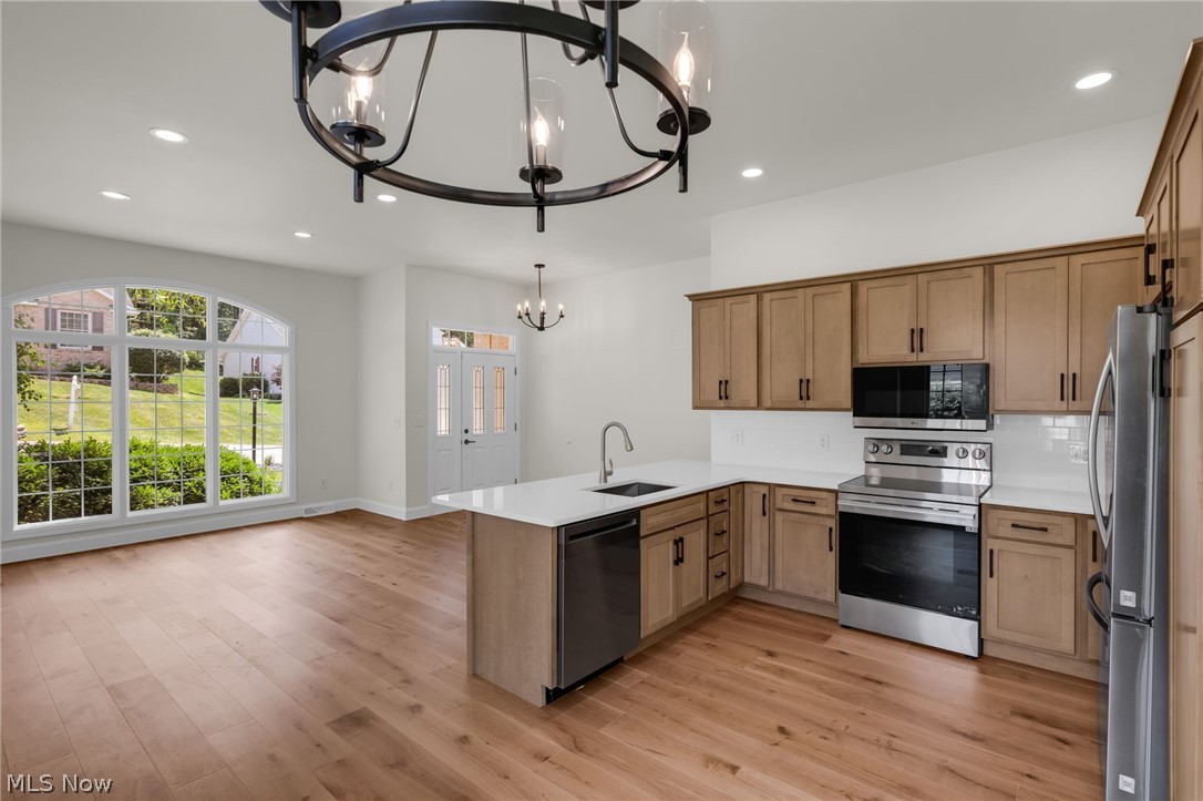 623 Bridgeview Avenue Chester, WV 26034 - Photo 10 of 47 Eat-in kitchen featuring stainless steel appliances and hardwood floors