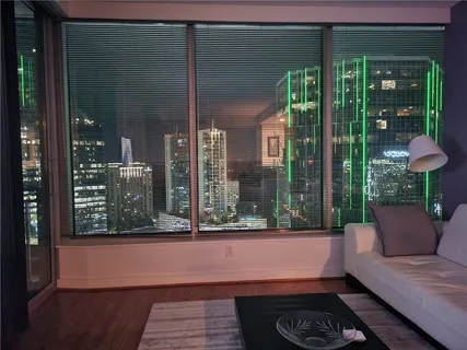 a balcony with furniture and a potted plant