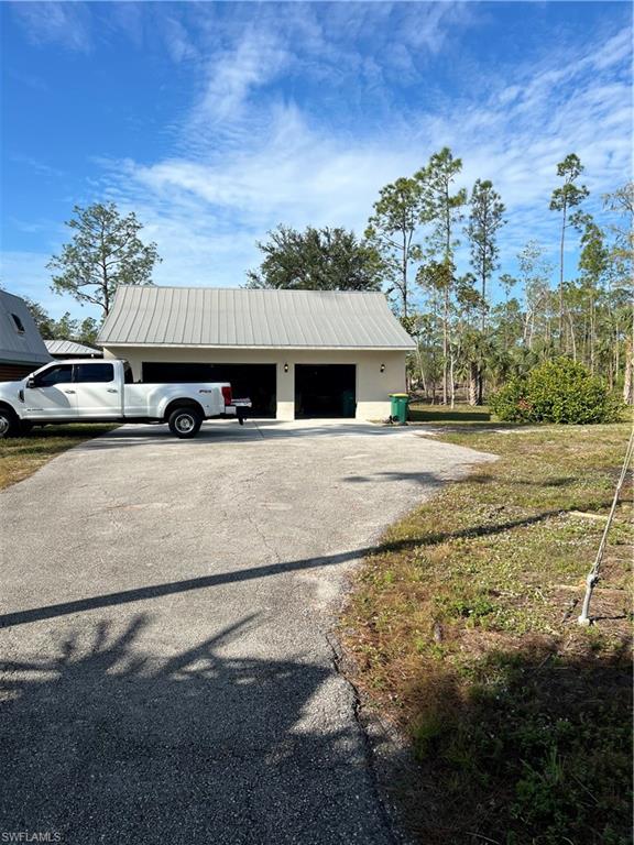 4395 18th Street Northeast Naples, FL 34120 - Photo 2 of 6 View of outdoor structure with a garage
