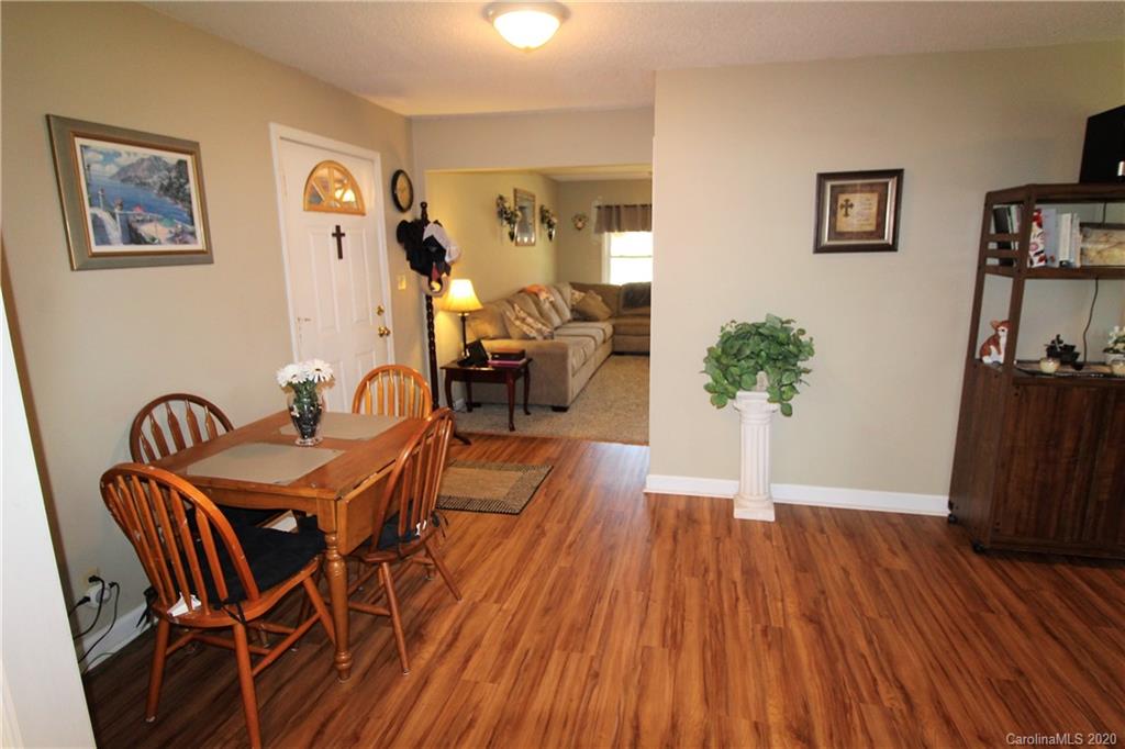 2333 Lawrence Road Clover, SC 29710 - Photo 8 of 35 a view of a dining room with furniture and wooden floor