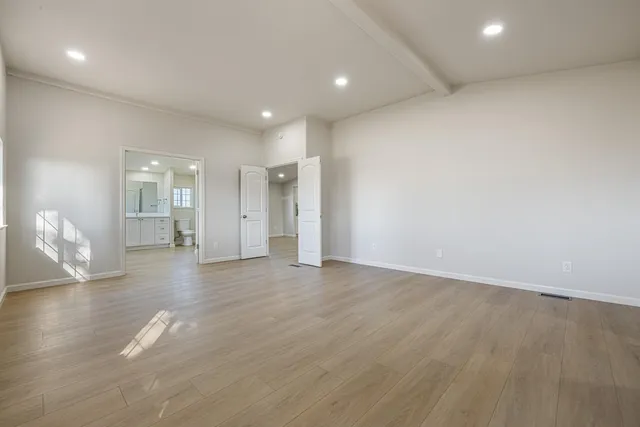 a spacious bathroom with a granite countertop sink mirror and double