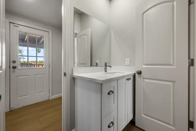 a white toilet sitting next to a shower