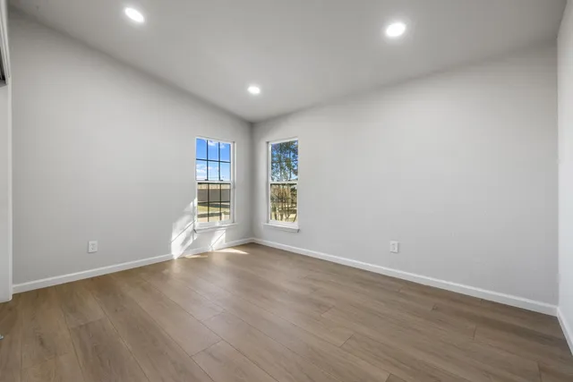 a view of backyard with small cabin