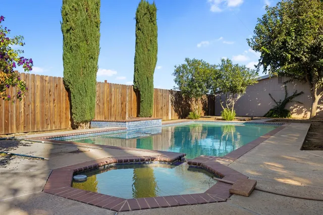 a view of yard with patio