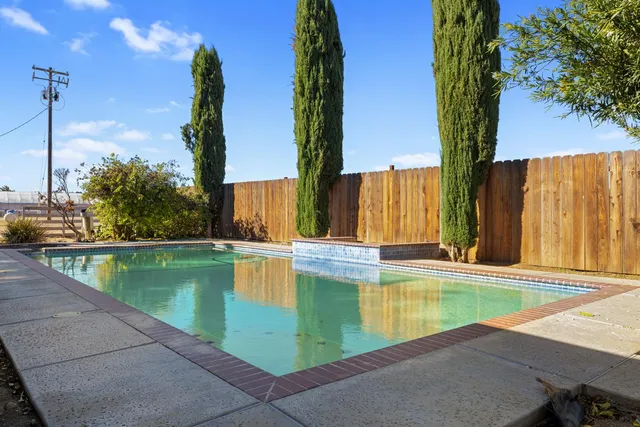 a house view with a backyard space