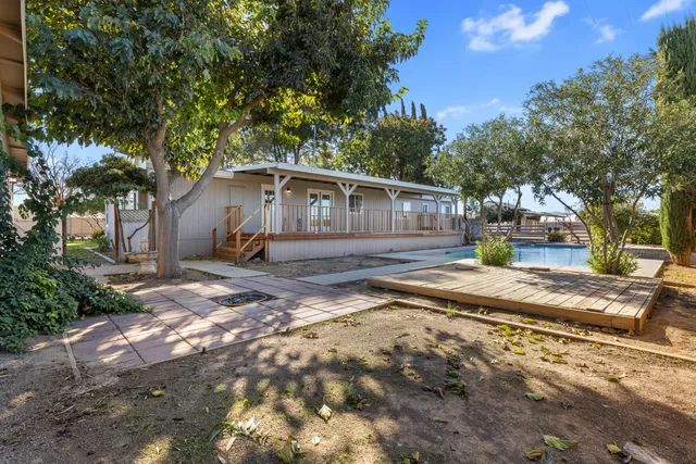 a view of a terrace with wooden floor and outdoor seating