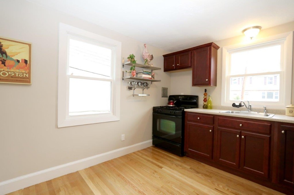 46-48 Raldne Road, Unit 48 Boston, MA 02136 - Photo 4 of 13 a kitchen with a cabinets and a window