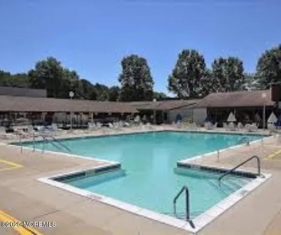 a view of a lake with a house in the background