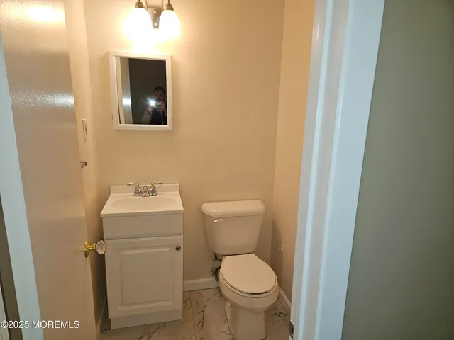 a bathroom with a toilet and a sink