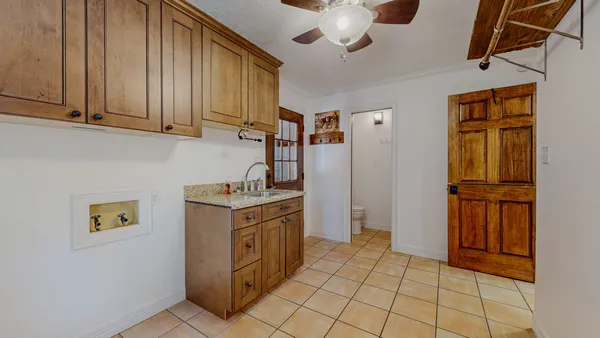 a kitchen with stainless steel appliances granite countertop a refrigerator a stove and a sink with dishwasher