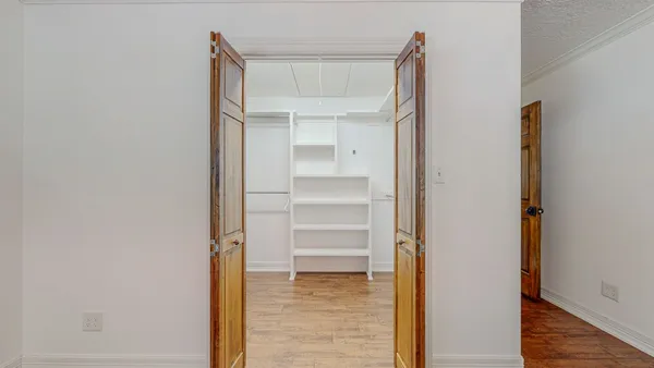 a view of an empty walk in closet