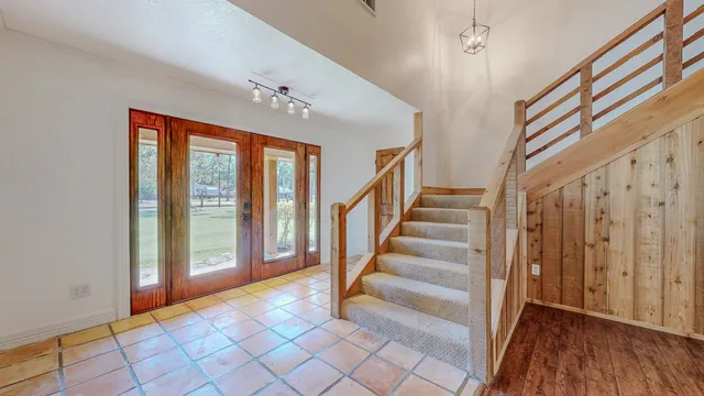 a view of entryway with stairs and wooden floor