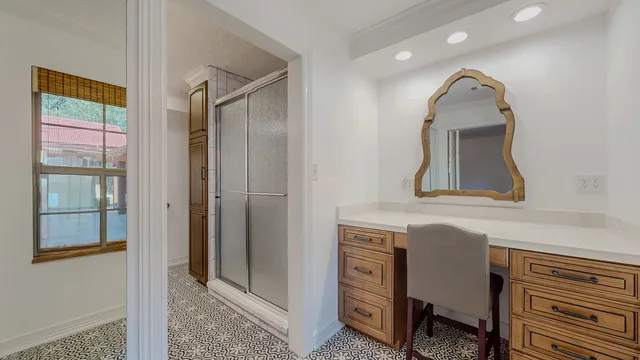 a bathroom with a sink a mirror and a window