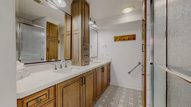 a bathroom with a double vanity sink and mirror