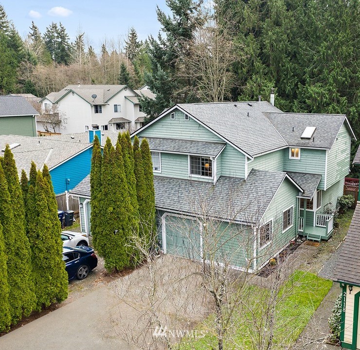 2122 186th Place Southeast Bothell, WA 98012 - Photo 2 of 25 an aerial view of a house with a yard and large trees