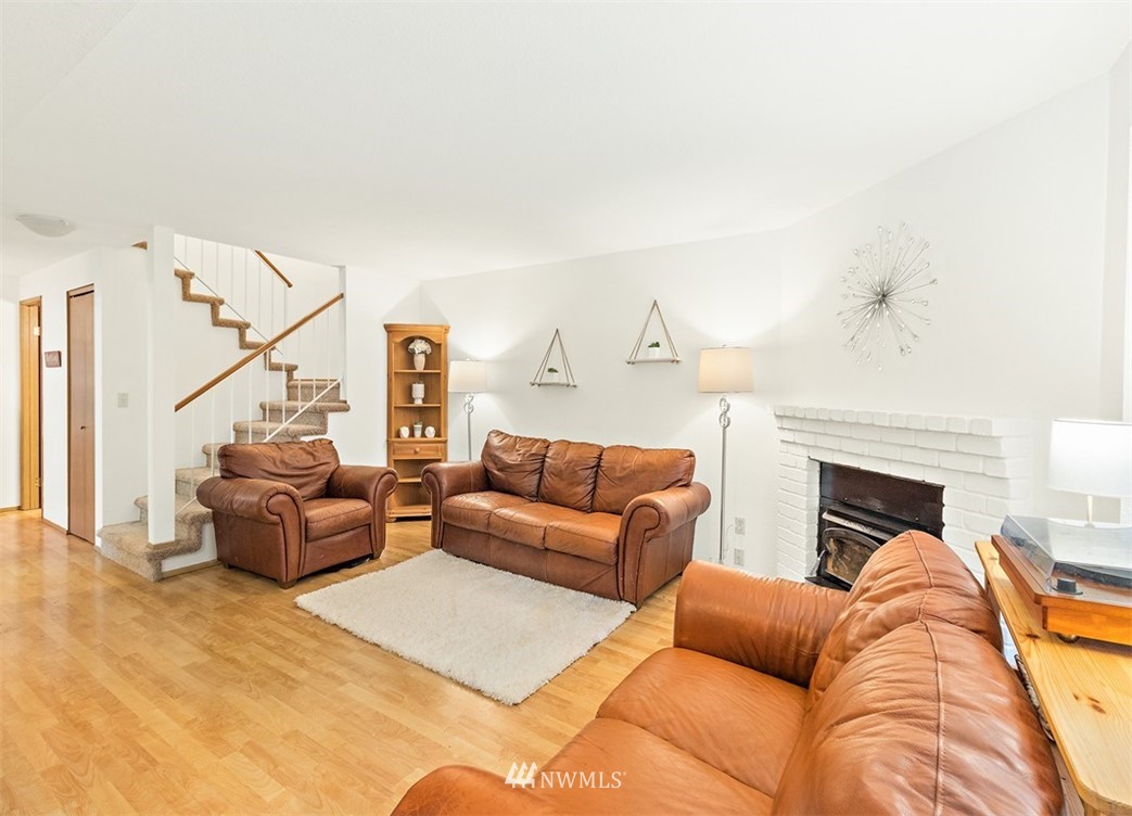 2122 186th Place Southeast Bothell, WA 98012 - Photo 11 of 25 a living room with furniture and a fireplace