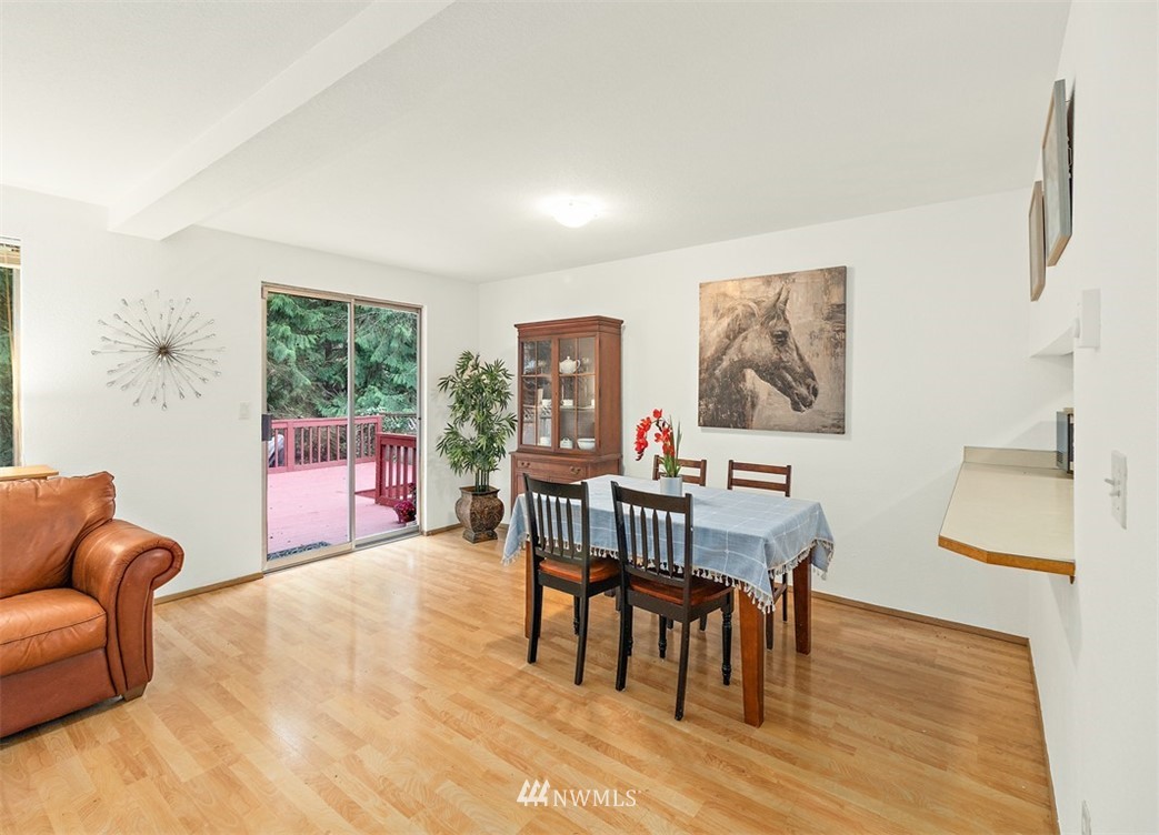 2122 186th Place Southeast Bothell, WA 98012 - Photo 14 of 25 a living room with furniture wooden floor and a window