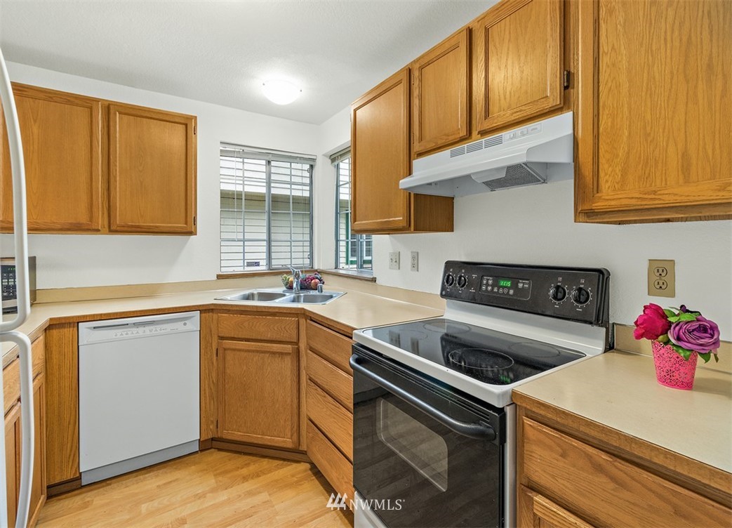 2122 186th Place Southeast Bothell, WA 98012 - Photo 16 of 25 a kitchen with a sink cabinets and appliances