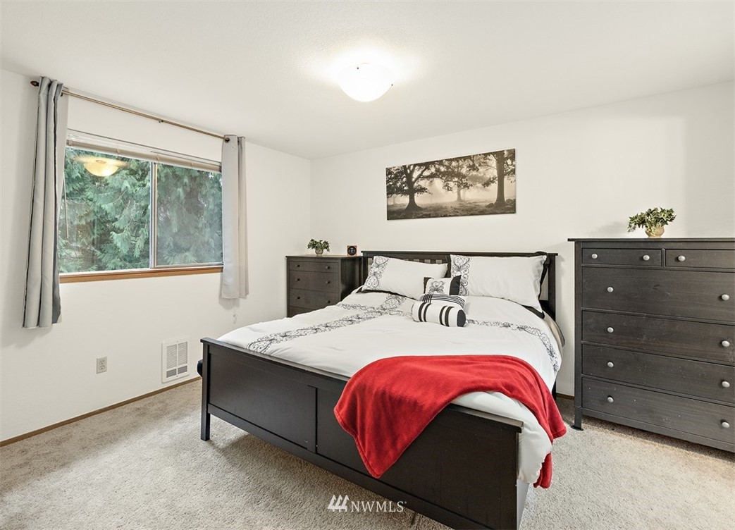 2122 186th Place Southeast Bothell, WA 98012 - Photo 20 of 25 a bedroom with a bed and window