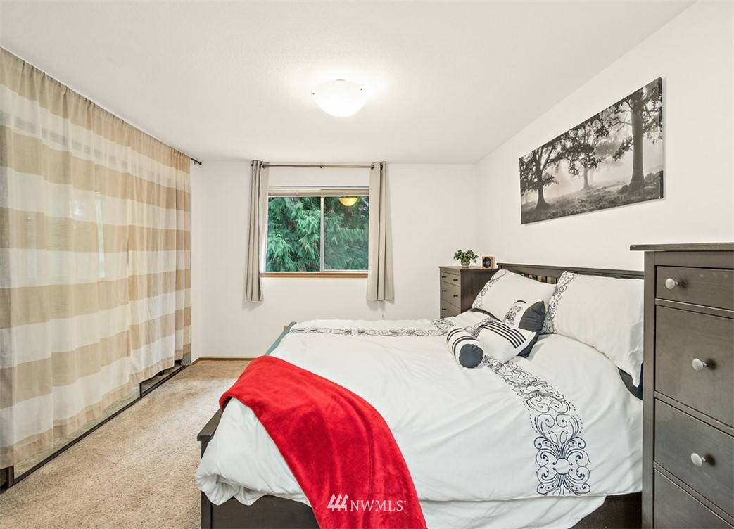 2122 186th Place Southeast Bothell, WA 98012 - Photo 21 of 25 a bedroom with a bed and a window