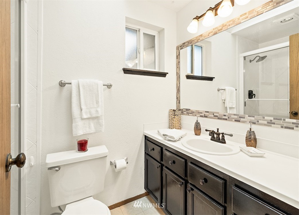 2122 186th Place Southeast Bothell, WA 98012 - Photo 22 of 25 a bathroom with a sink vanity mirror and toilet