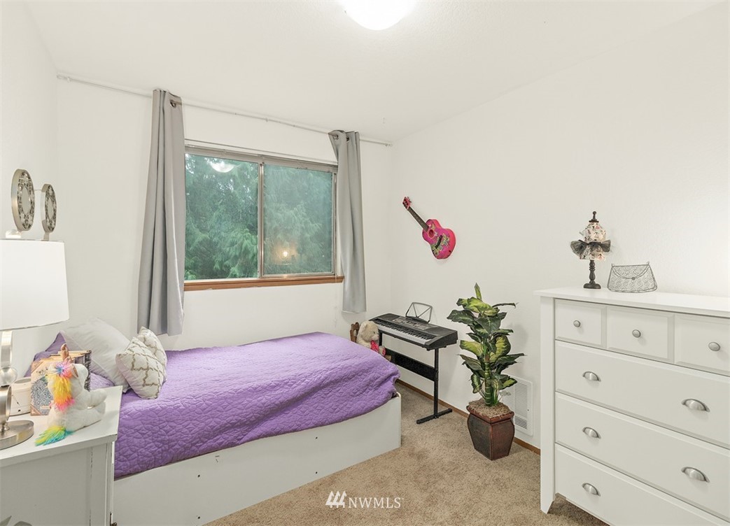 2122 186th Place Southeast Bothell, WA 98012 - Photo 23 of 25 a bedroom with a bed and a dresser