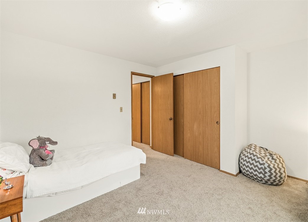 2122 186th Place Southeast Bothell, WA 98012 - Photo 25 of 25 a bedroom with a bed and a cabinets