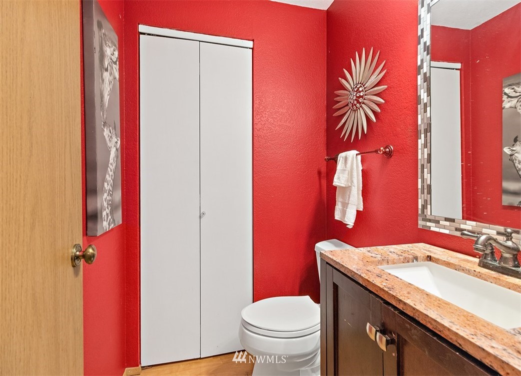 2122 186th Place Southeast Bothell, WA 98012 - Photo 9 of 25 a bathroom with a granite countertop sink and a mirror