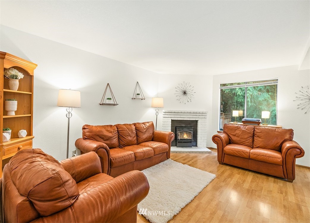 2122 186th Place Southeast Bothell, WA 98012 - Photo 10 of 25 a living room with furniture fireplace and a large window