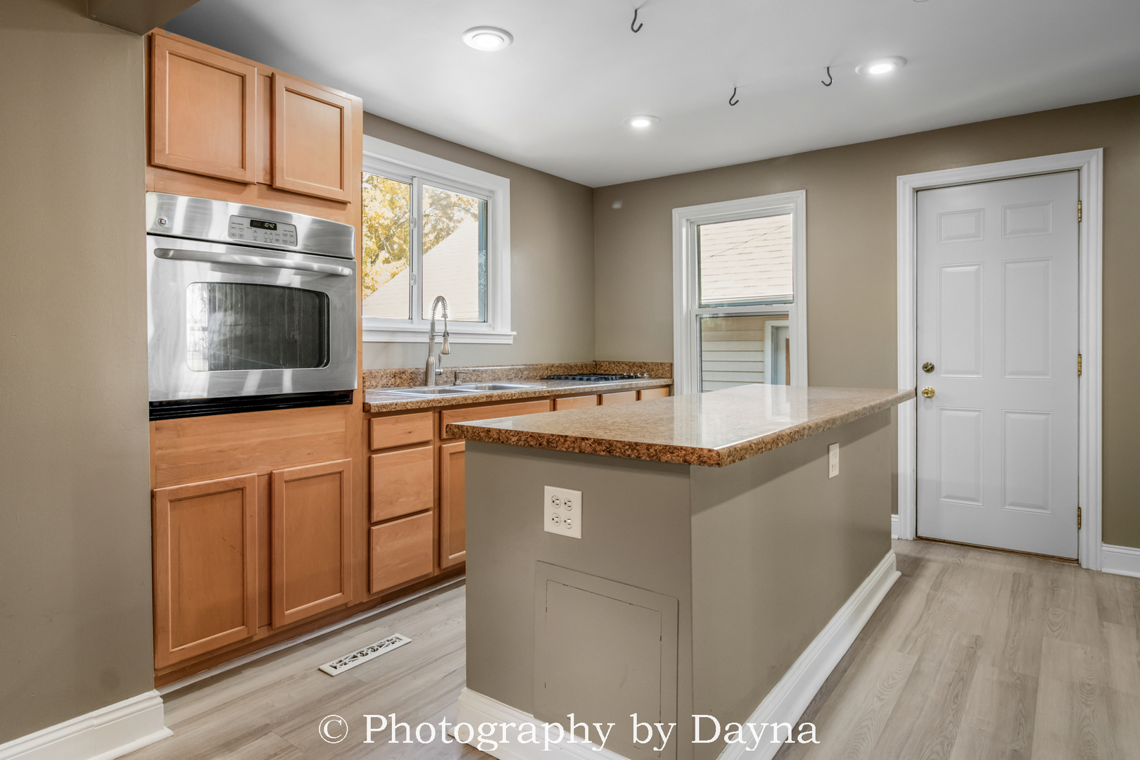 569 South Chestnut Street Chebanse, IL 60922 - Photo 4 of 22 a kitchen with stainless steel appliances granite countertop a stove a sink and a refrigerator