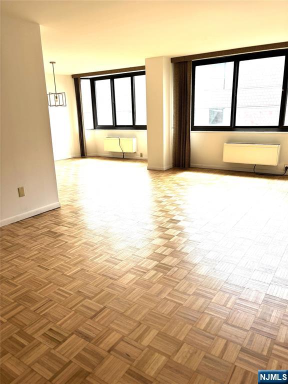 344 Prospect Avenue, Unit 9G Hackensack, NJ 07601 - Photo 15 of 16 a view of empty room with window and refrigerator