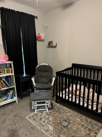 a room with furniture and a rug