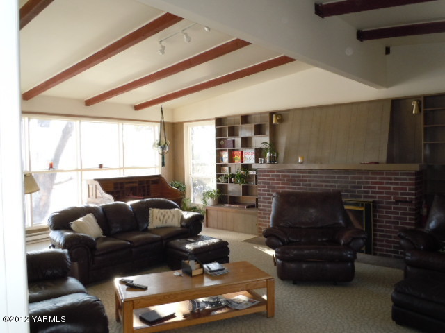 801 Clark Road Wapato, WA 98951 - Photo 23 of 28 a living room with furniture and a fireplace