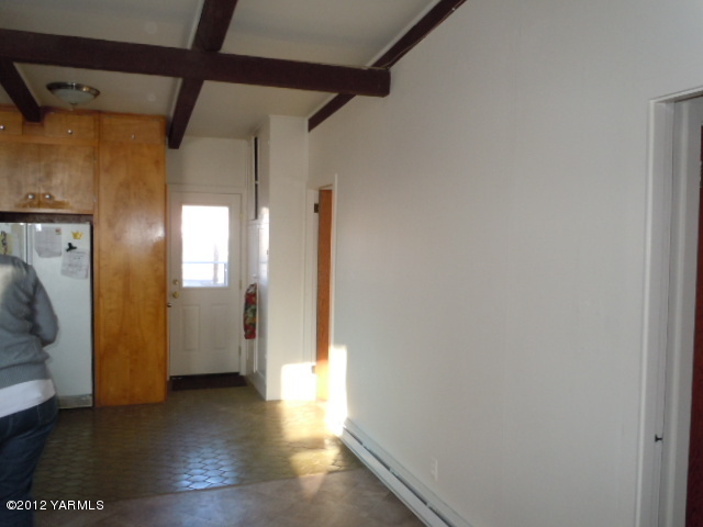 801 Clark Road Wapato, WA 98951 - Photo 25 of 28 a view of a hallway with wooden floor