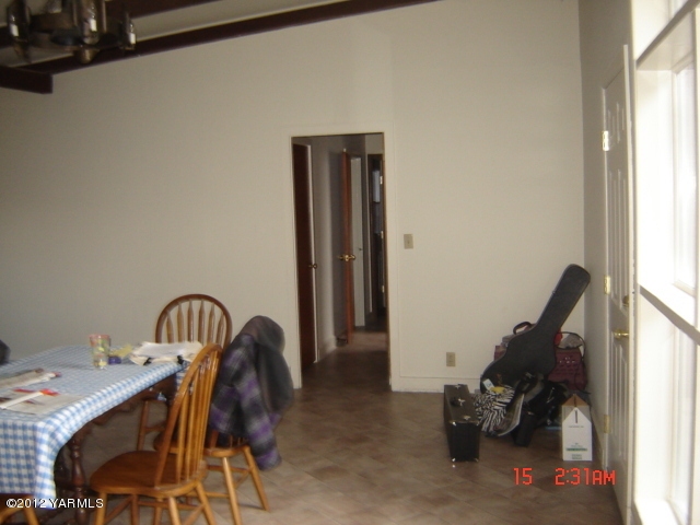 801 Clark Road Wapato, WA 98951 - Photo 10 of 28 a view of a workspace with furniture and windows
